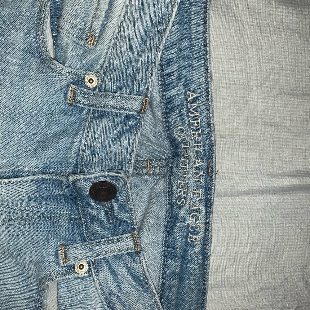 Ripped blue jeans, American eagle outfitters